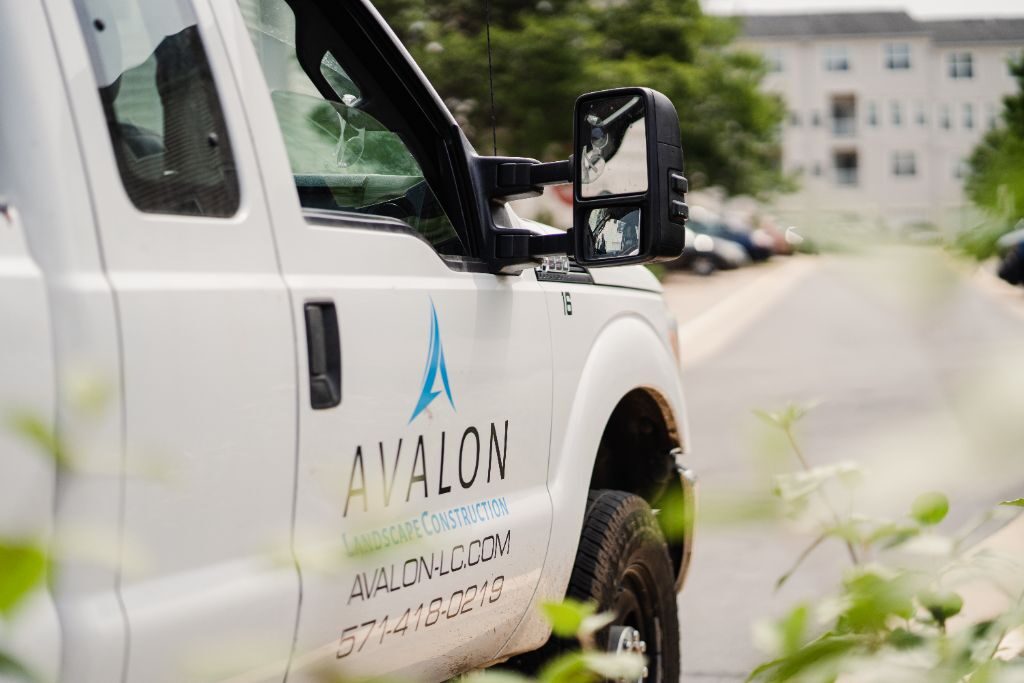 Avalon Landscape Construction truck parked at a commercial property