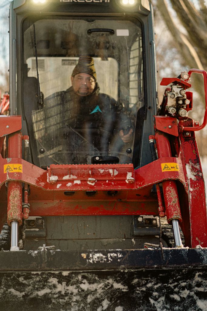 Takeuchi track loader operator working through the night